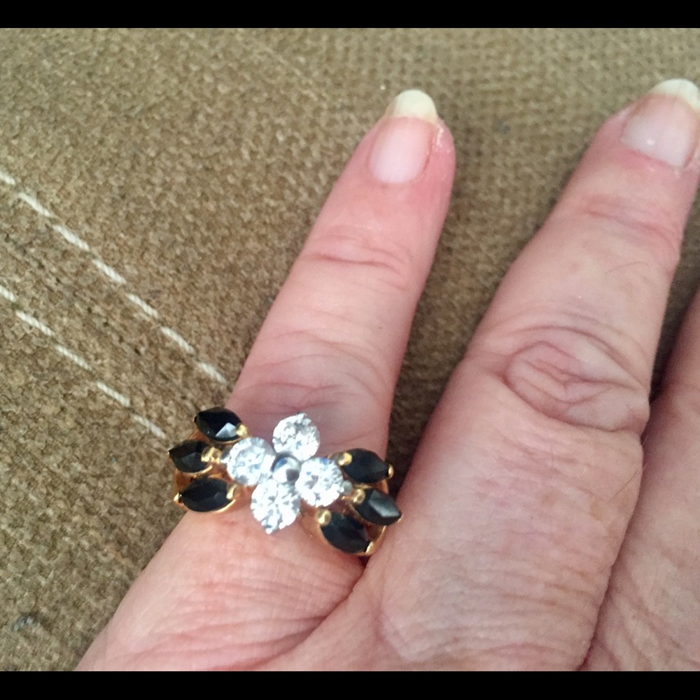 Cubic zirconium flowers with black onyx accents.